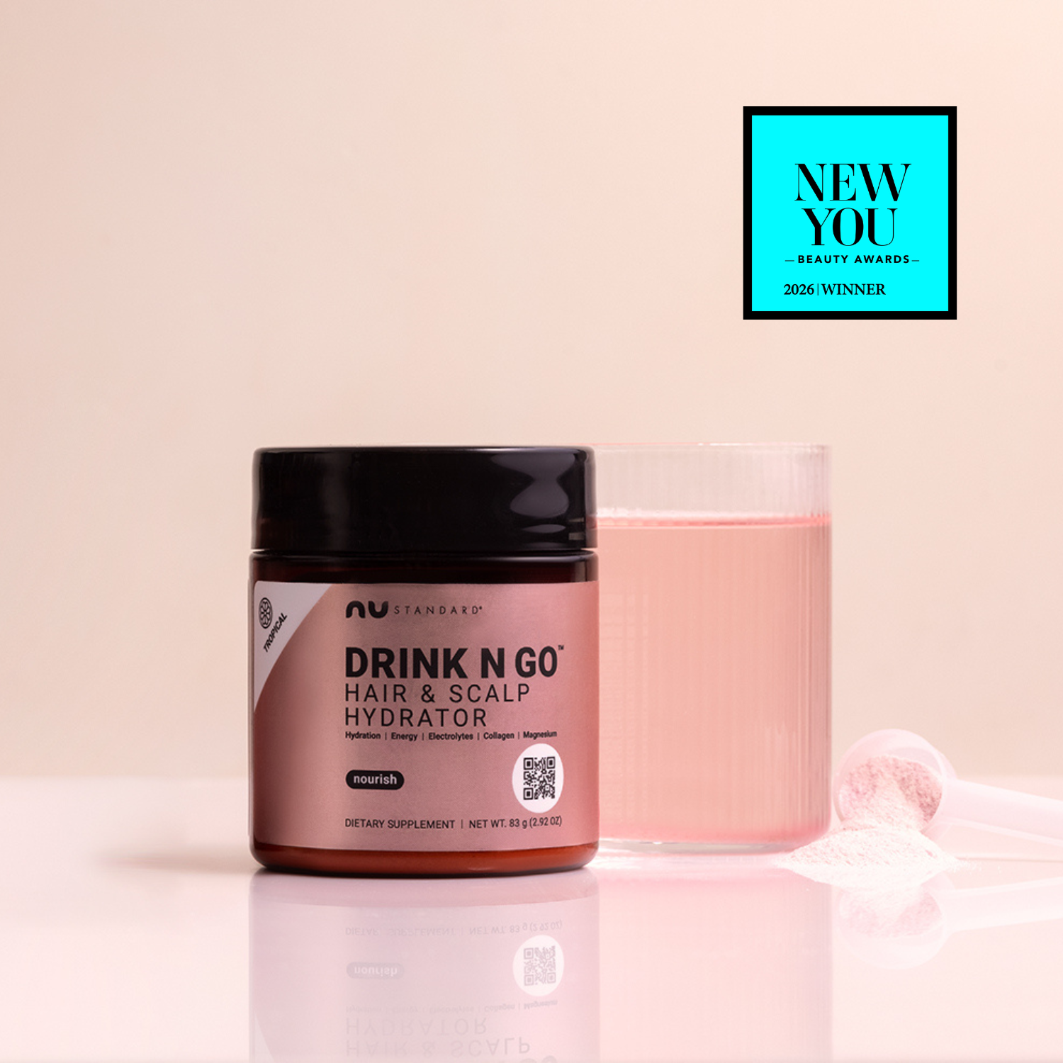 Hair and scalp hydrator product with pink container and black lid on a light pink background